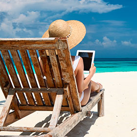 lady on beach with tablet