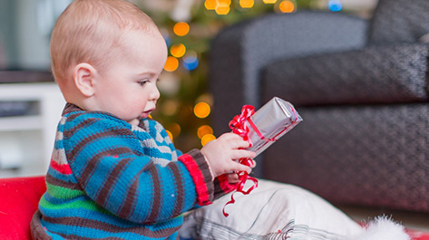 Baby with home made gift to lower your holiday spending