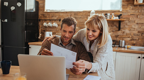 Couple looking over their savings for their energy bill