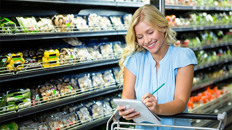 Woman looking over her meal planning for the week