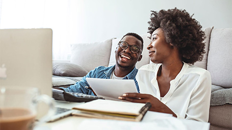 Couple doing taxes since they protected themselves against tax identity theft