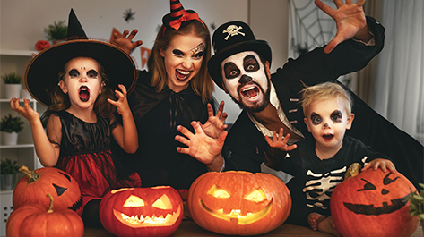 Family ready for Halloween with their costumes.