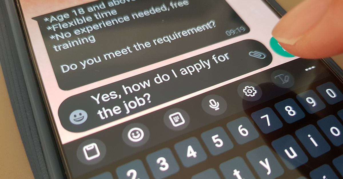 Scam job text message on a smartphone screen.