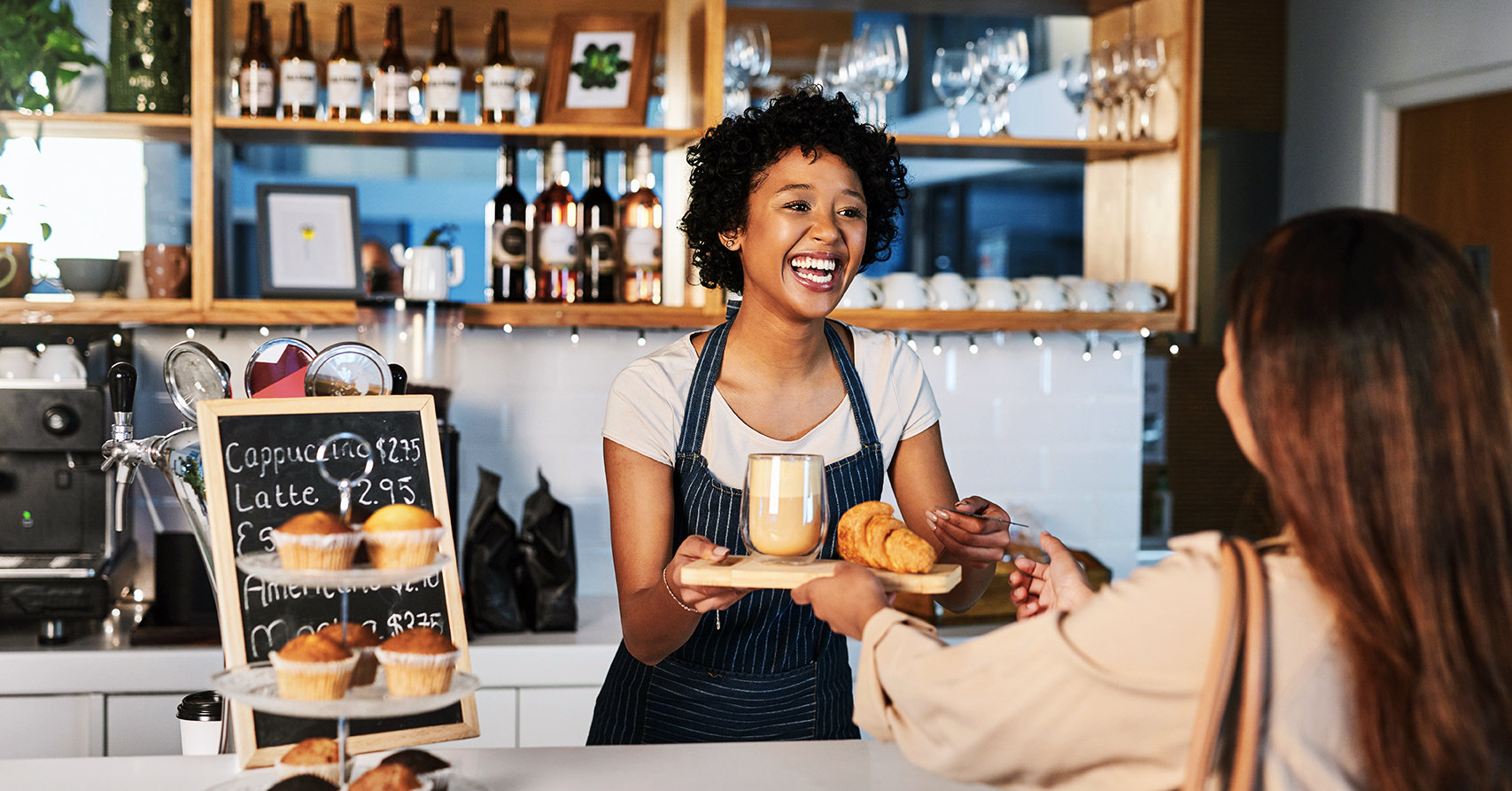 Teen serving coffee while working her summer job in palm beach county