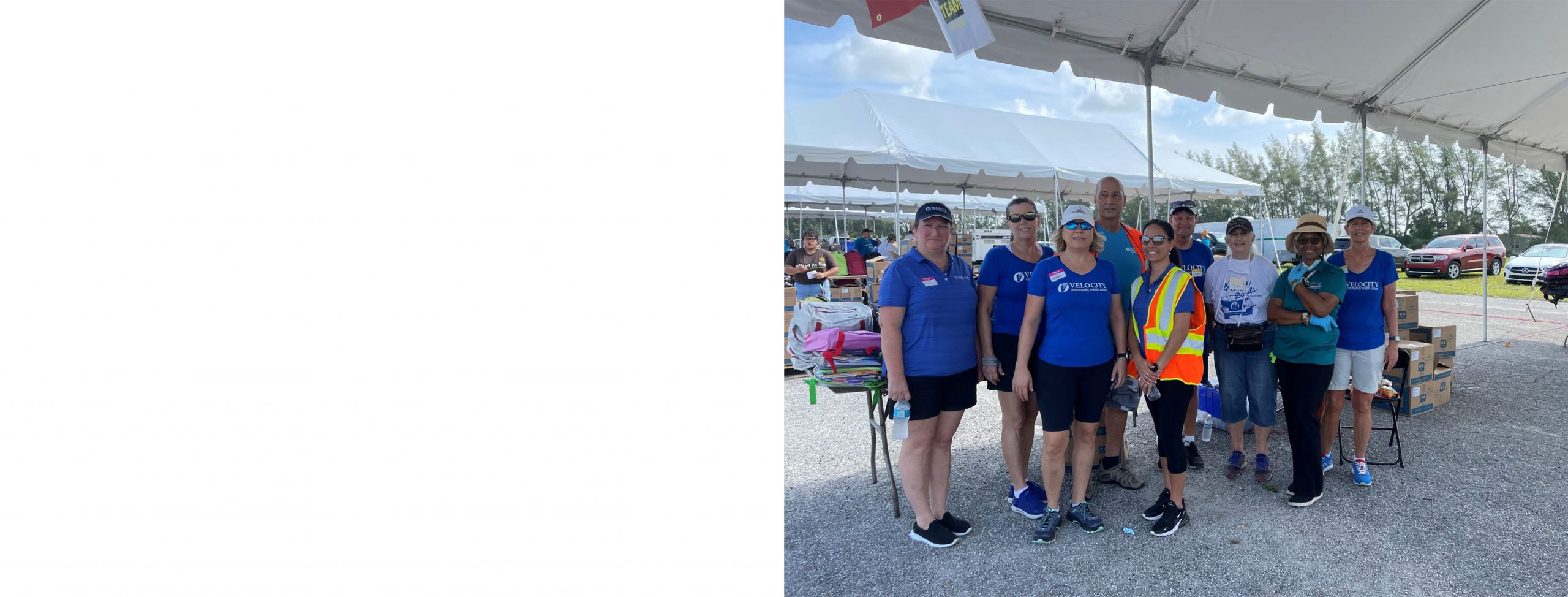 Group of Velocity Community Credit Union Staff volunteering at the Back to School Bash
