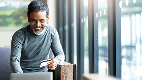 Man transferring credit card balance