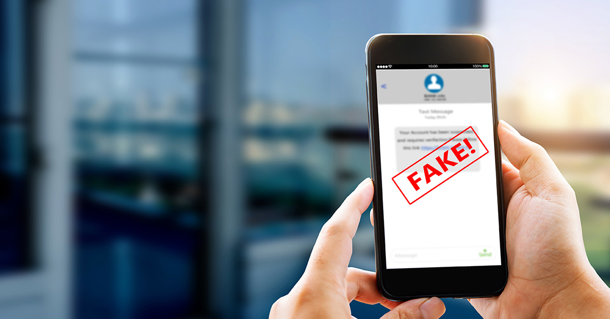 Auto Dealer Scam Text on a cell phone with word FAKE written over the phone screen